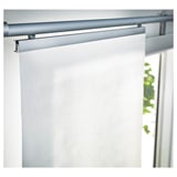 White roller blind partially rolled up, mounted on a minimalist silver track above a window. Lightly filters outside light.