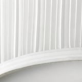 A sleek white modern lamp with a soft diffusion shade, emitting gentle light.