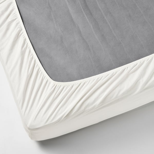 Organic cotton fitted sheet with elastic edges, white, fits mattresses up to 26 cm.