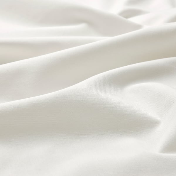 Soft, smooth white fabric close-up, showcasing fine texture and quality.