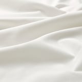 Soft, smooth white fabric close-up, showcasing fine texture and quality.