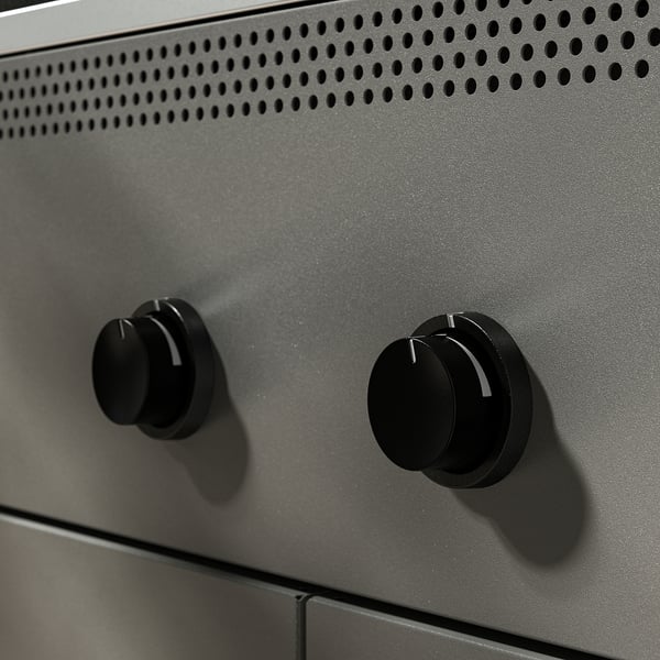 Close-up of high-quality BÅTSKÄR grill knobs; durable knurled dials on sleek, perforated metal surface.