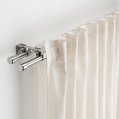 BEKRÄFTA chrome curtain rod set with brackets and finials. Modern metallic, sleek design.