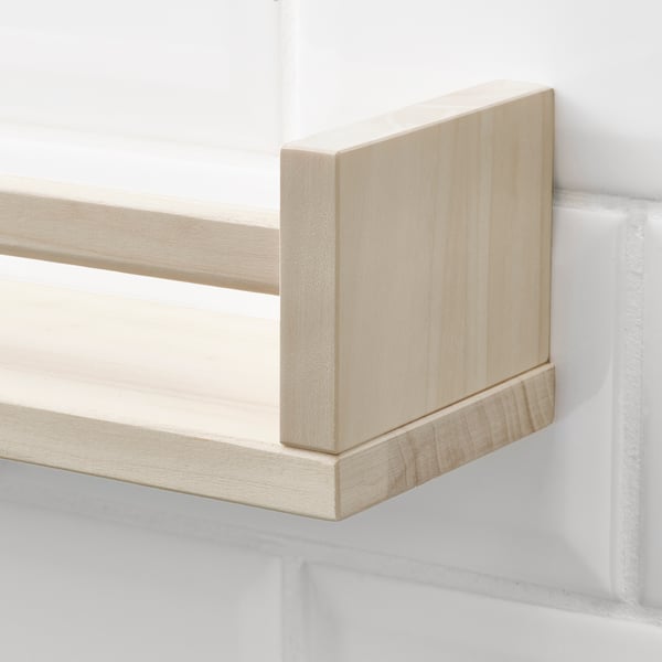 A light-colored wooden shelf, well-crafted with smooth edges, mounted on a white wall. Its sturdy and designed for kitchen storage.
