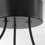 Black metal pendant lamp with three adjustable braided cables. Close-up of ceiling cup detail.