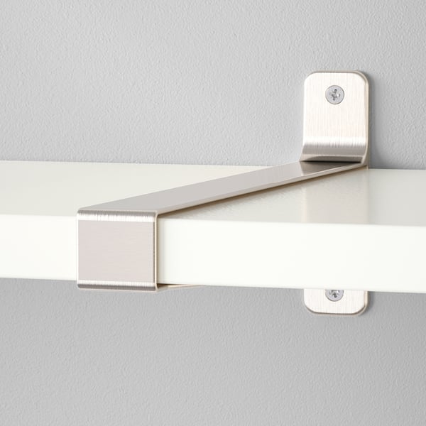 Close-up of modern wall shelf with brushed metal brackets, securely fixed to a pale wall, showing clean lines and robust design.