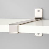 Close-up of modern wall shelf with brushed metal brackets, securely fixed to a pale wall, showing clean lines and robust design.