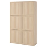 A light wooden BESTÅ cabinet with six doors for storage.