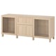 Option: Light oak BESTÅ storage set with shelves, drawers, and glass doors.