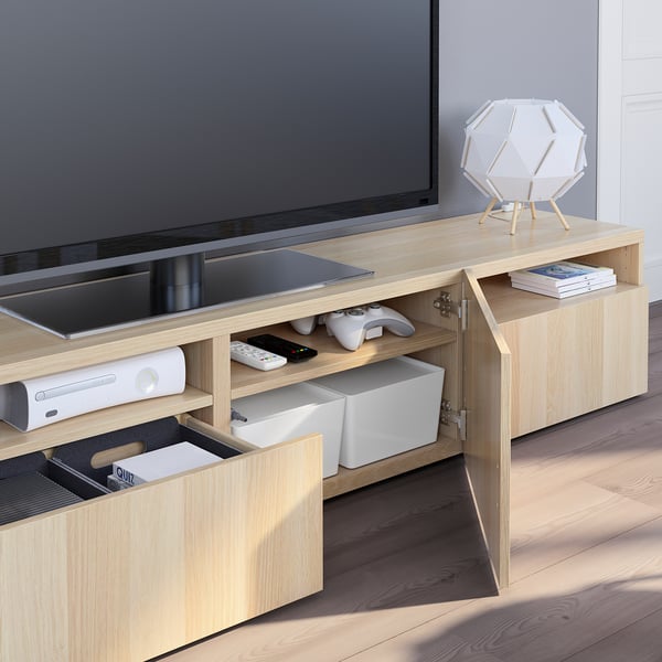 Light wood tv stand with open drawers showing storage for gaming controllers, cables managed at back, soft-close feature, and supports up to 30 kg tv.