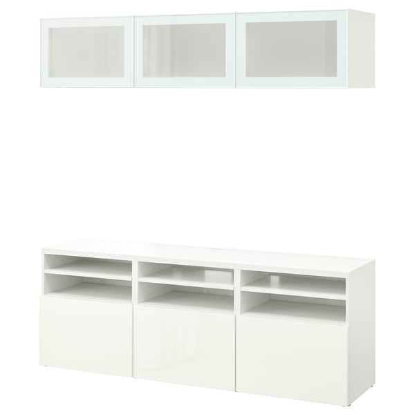 White BESTÅ storage set with wall cabinets and tv bench.