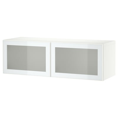 A white BESTÅ storage unit with frosted glass doors, rectangular and modern design.