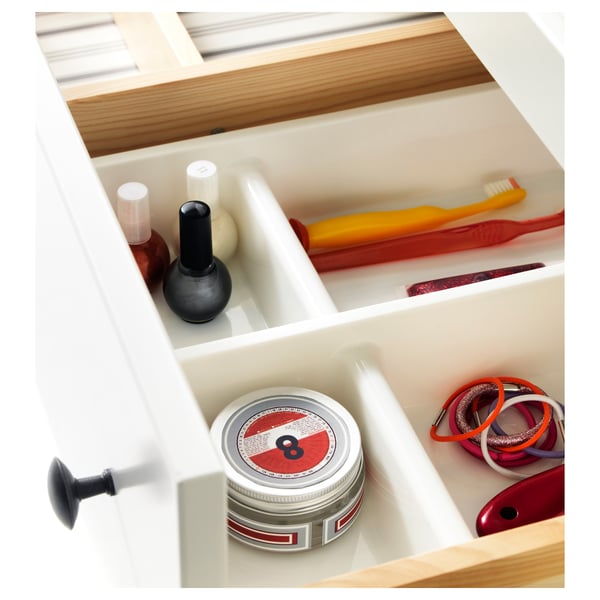 Drawer organizer with toothbrush, nail polish, hair elastics, and tin can.