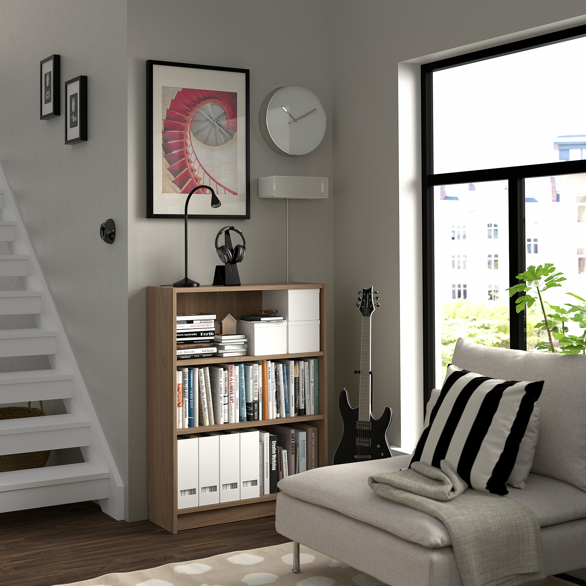 Modern living room with BILLY bookcase, couch, guitar, and urban view.