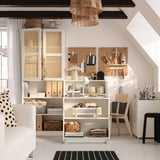 BILLY bookcase combo, white, mixed storage, foldable tables, wooden accents, books, crafts. Larger than chair & stool, maximizing space.