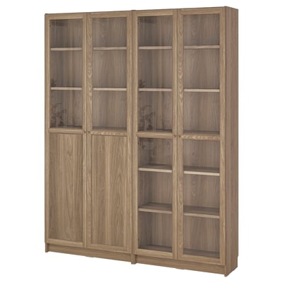 A BILLY bookcase in oak veneer with glass doors, featuring multiple shelves for storage.
