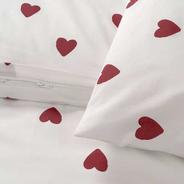 White duvet cover with red heart patterns, made of soft, breathable cotton and rayon blend, featuring a practical zip closure.