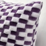 Close-up of a soft, purple and white checkered cushion cover with 3d effect, showcasing its texture.