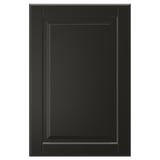 A single black BODBYN cabinet door with a classic beveled panel design, smooth lacquered finish.