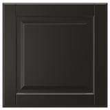A black BODBYN cabinet door with a square, bevelled panel design. Its smooth and glossy with a modern, sleek look.