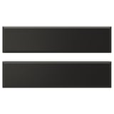 Two black rectangular drawer fronts with beveled edges. Modern, sleek design. Made of fibreboard and polyurethane paint.