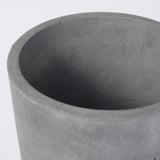 Large, round, gray concrete planter, smooth texture, minimalist design.