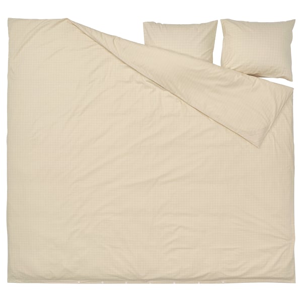 A beige DOFTAKLEJA duvet cover with check and stripe patterns, featuring corner holes for easy duvet insertion.