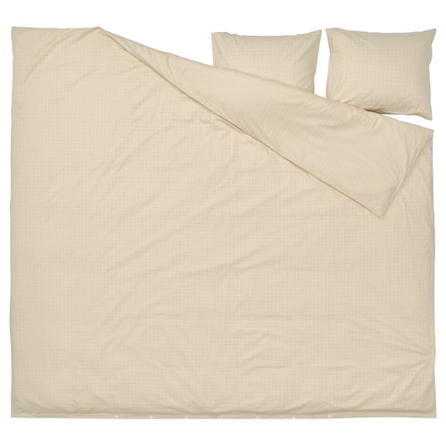 A beige DOFTAKLEJA duvet cover with check and stripe patterns, featuring corner holes for easy duvet insertion.