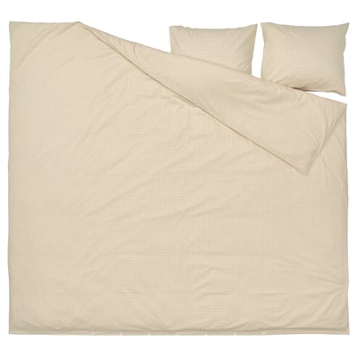A beige DOFTAKLEJA duvet cover with check and stripe patterns, featuring corner holes for easy duvet insertion.