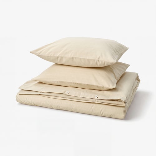 A folded beige DOFTAKLEJA duvet cover set with a chequered design, made of 100% cotton.
