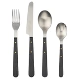 Four-piece DOFTSKÖLD cutlery set in black with gold accents, featuring stainless steel handles and classic design.