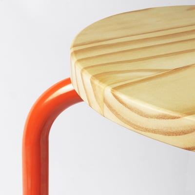 Modern red metal stool with light wooden seat, smooth edges.