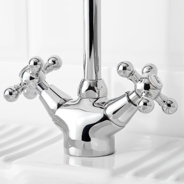 Chrome faucet with cross handles and high spout.