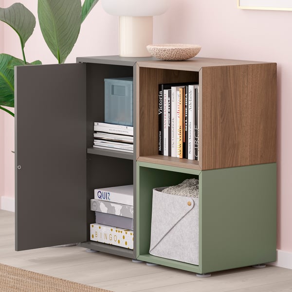 Storage unit with books, games, basket on top, open and closed sections.