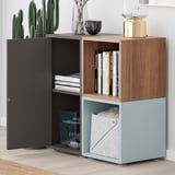 Modern bookshelf with open shelves, closed compartments, decor, and a plant near a window.