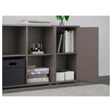 Gray EKET storage unit with adjustable shelves and open access compartments; one door partially open.