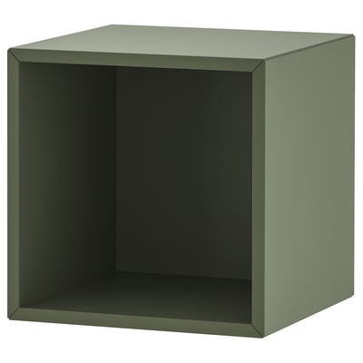 An ikea EKET shelf in green. Its a square, open storage unit made of particleboard and fiberboard with a modern design.