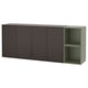 The EKET storage unit, a modern wall-mounted cabinet in dark gray with an open green shelf, combining both storage options for versatile use.