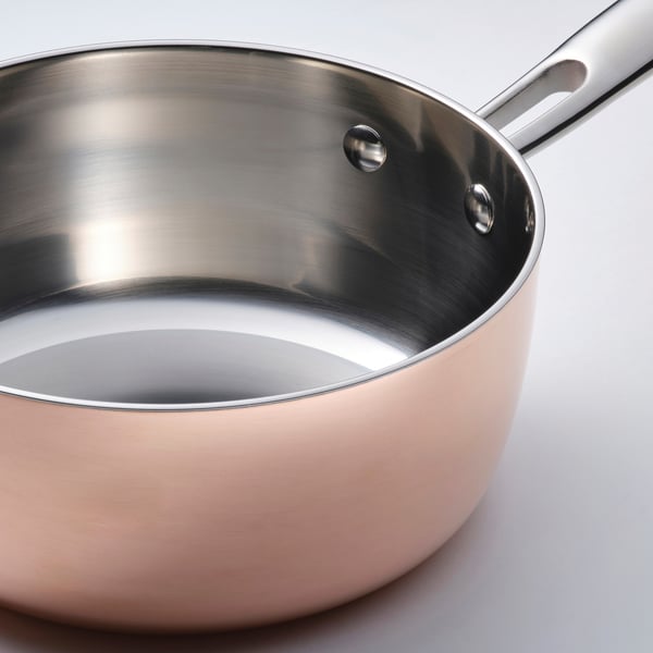 High-quality stainless steel saucepan with shiny, mirror-like interior and durable handle.