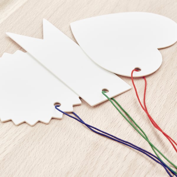 White labels on wood with elastic strings, showcasing quality craftsmanship.