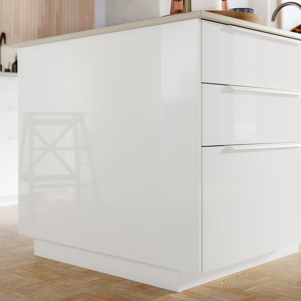 A modern, bright white FÖRBÄTTRA unit with sleek surfaces and minimalist design.