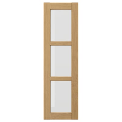 FORSBACKA wooden kitchen cabinet with 3 glass sections, beveled edges, warm oak finish.