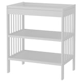 A white GULLIVER changing table, featuring three shelves for storage, a smooth top surface, and sturdy vertical wooden slats.