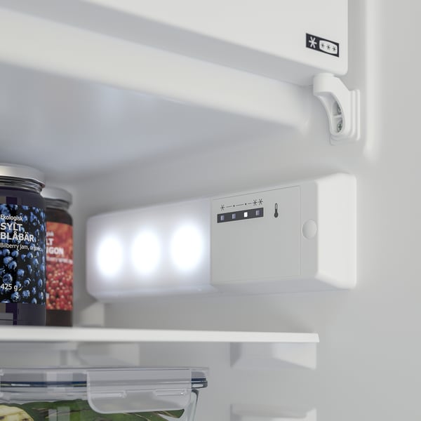 Fridge door with adjustable shelves and control panel for temperature settings.