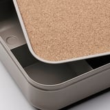 Metal desk organizer with cork top, sleek design and quality feel.