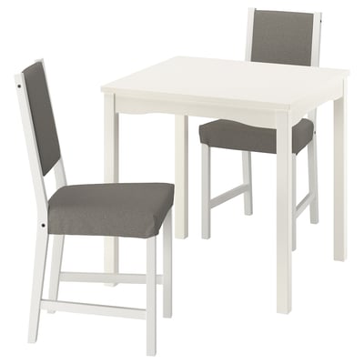 Small white dining set includes table & 2 cushioned grey chairs, modern and comfortable.