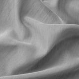 Close-up of soft, grey, lightweight curtains with slight folds, fine weave, offering privacy.
