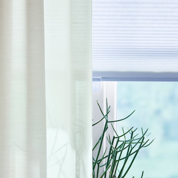 HOPPVALS white cellular blind; softens light, adds privacy.