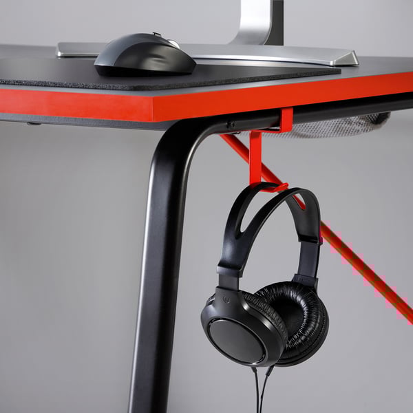 Modern gaming desk with mouse, keyboard, and headphones hook. Black with red accents, sturdy and stable.