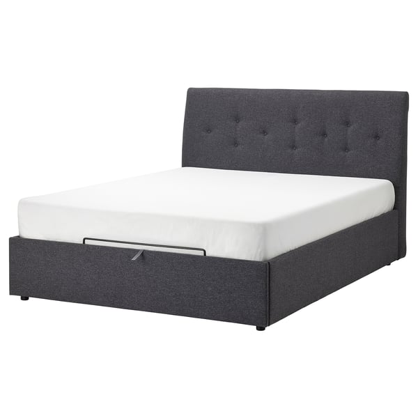 Dark gray upholstered bed with tufted headboard and white mattress.